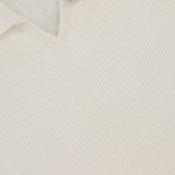 A close-up of the BRUNELLO CUCINELLI Polo Short Sleeve Sweater in white, crafted in an English rib knit.
