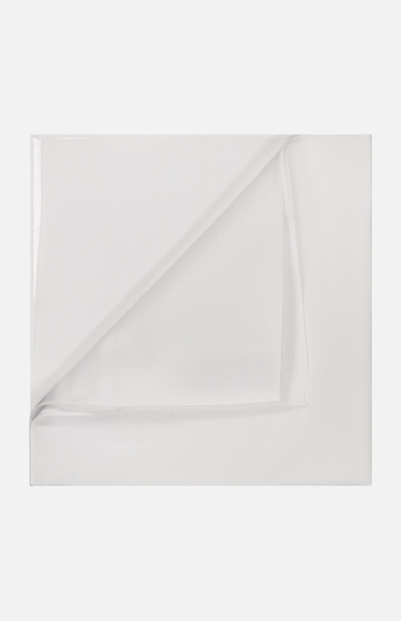 A neatly folded BRUNELLO CUCINELLI Sea Island Cotton Twill Pocket Square is displayed on a flat white surface, with one corner partially turned to reveal the underside.