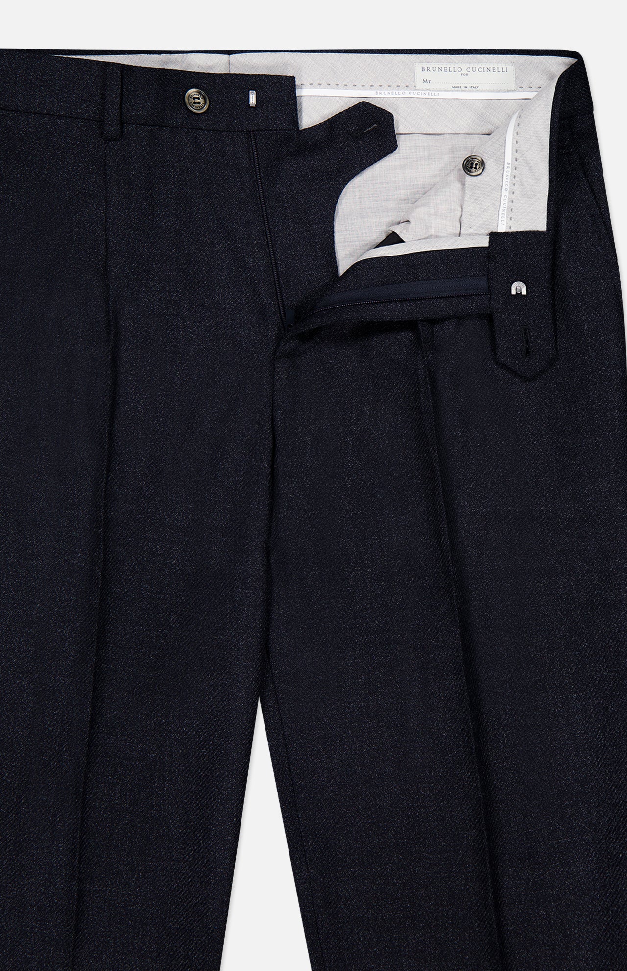 The Wool Suit Trouser Pant by BRUNELLO CUCINELLI showcases a dark navy shade with neat pleats, a structured waistband, and refined button closure—partially unzipped to reveal its inner lining and precise button accents. Expertly crafted from subtly textured virgin wool, these trousers are completed with sharp, visible creases for an impeccably polished appearance.