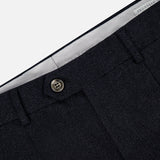 Close-up of the waistband and upper front section of the BRUNELLO CUCINELLI Wool Suit Trouser Pant in dark grey, highlighting a button closure, belt loops, and a partially visible brand label inside the waistband.