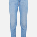 The Traditional Fit Light Denim jeans by BRUNELLO CUCINELLI feature a light blue wash with a classic five-pocket design and button closure, inspired by vintage denim, and are shown against a plain white background.