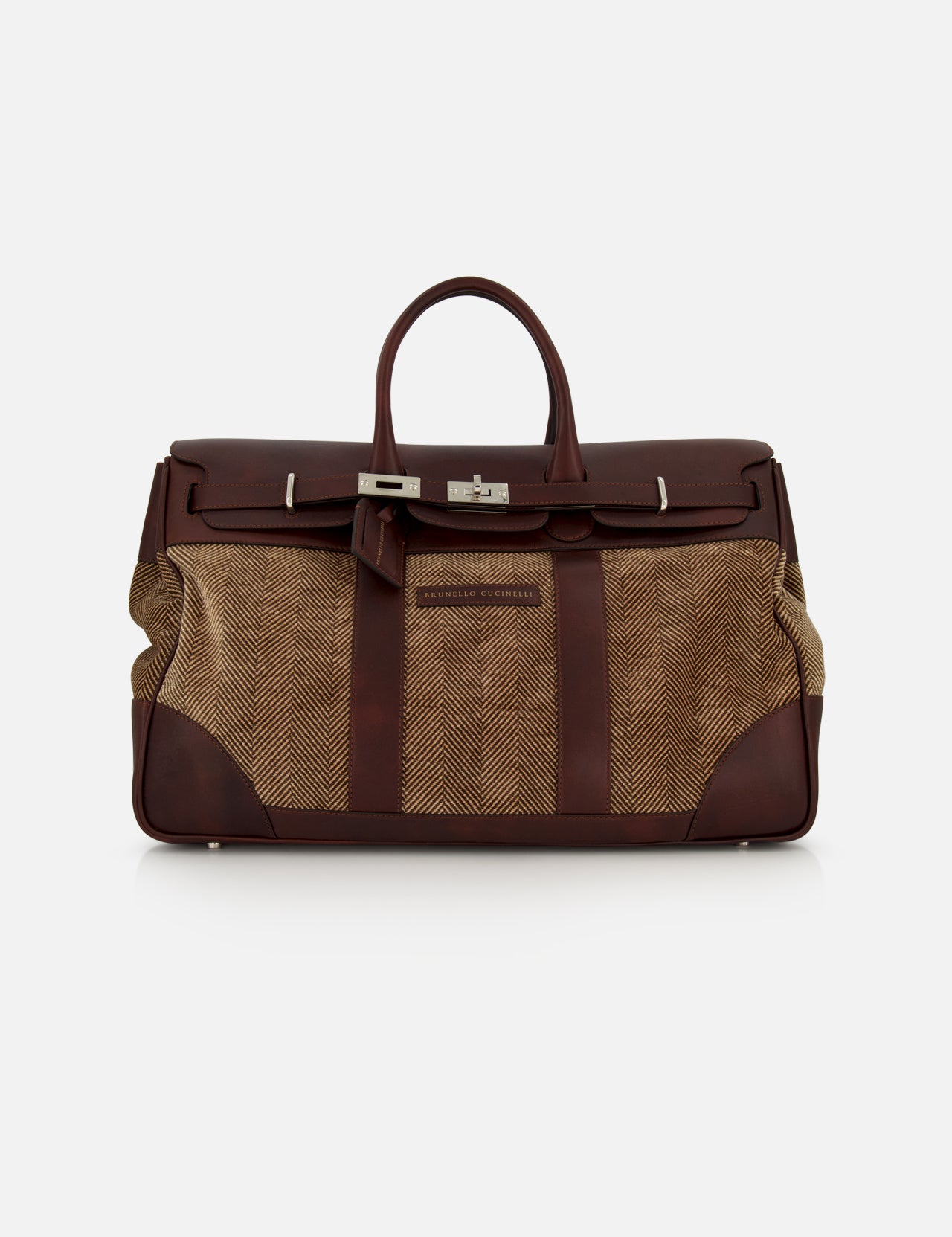 The BRUNELLO CUCINELLI Travel Duffle Bag with Chevron-effect, crafted in large brown leather and tan fabric with silver hardware and a top handle, features a structured rectangular silhouette. Vintage-inspired details exude timeless elegance, beautifully showcased against a plain white background.