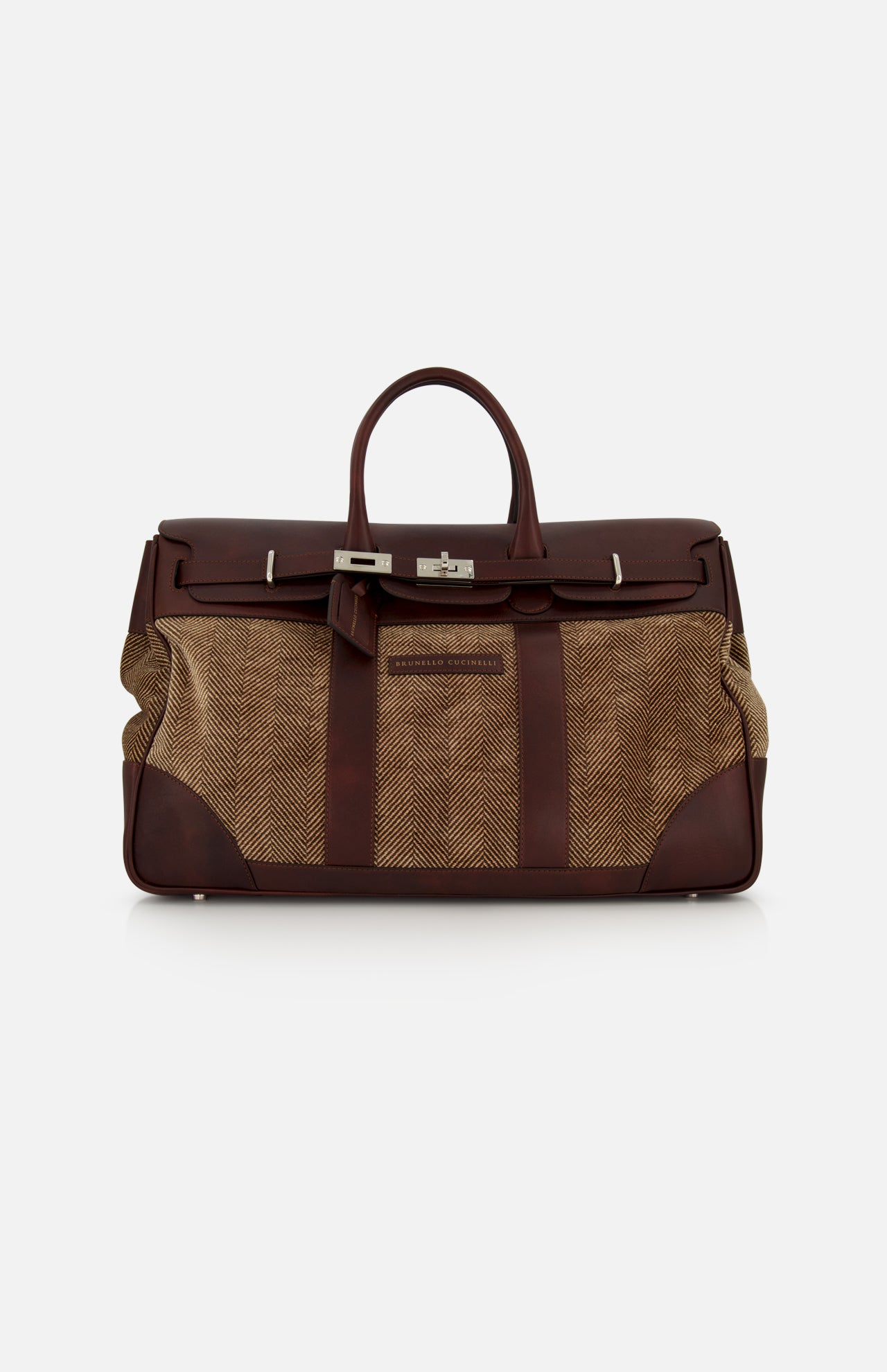 The BRUNELLO CUCINELLI Travel Duffle Bag with Chevron-effect, crafted in large brown leather and tan fabric with silver hardware and a top handle, features a structured rectangular silhouette. Vintage-inspired details exude timeless elegance, beautifully showcased against a plain white background.