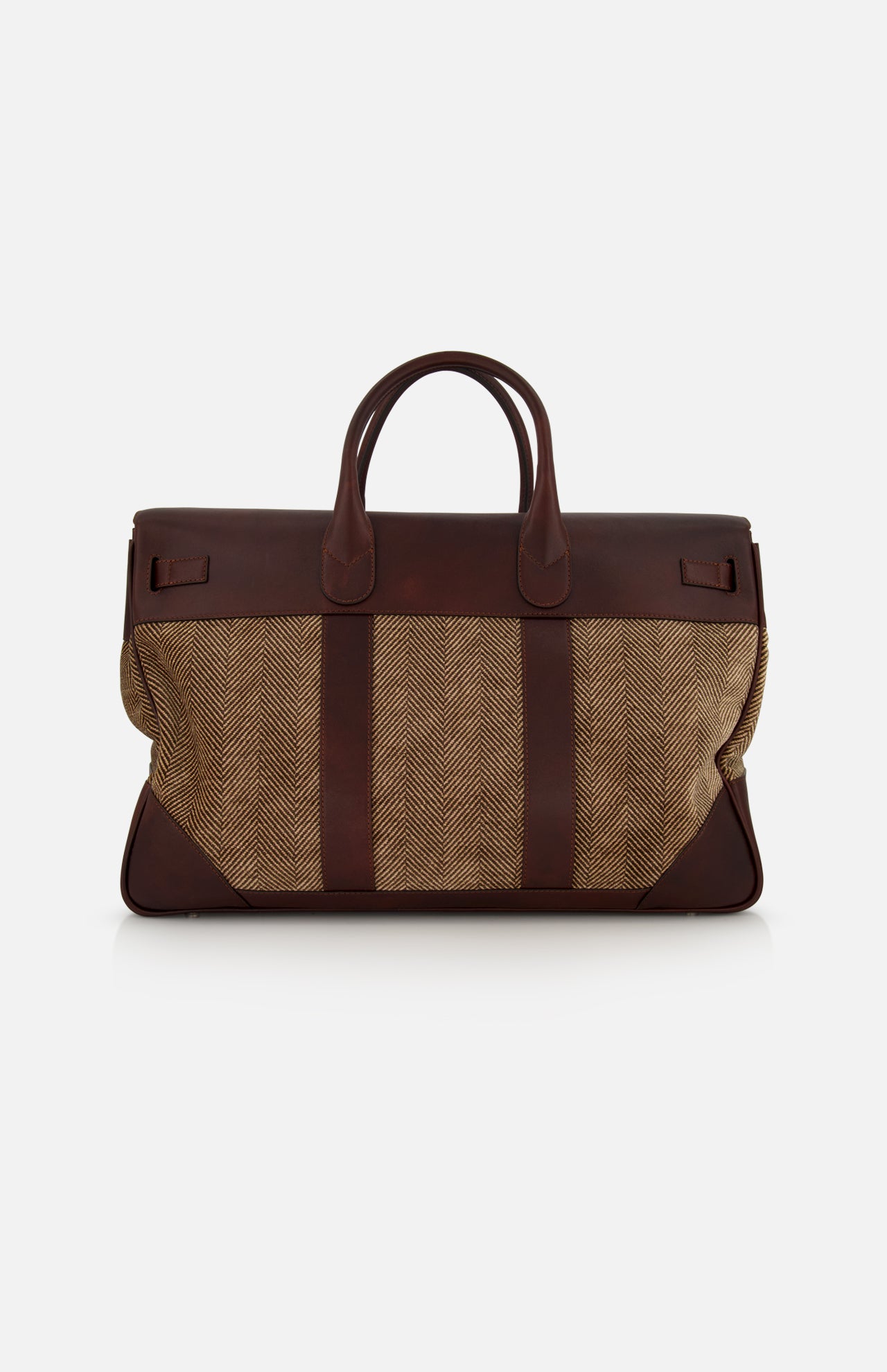 The BRUNELLO CUCINELLI Travel Duffle Bag with Chevron-effect features a combination of brown leather and tan herringbone fabric, two handles, a structured silhouette, and a distinctive vertical stripe pattern on the front. Reminiscent of vintage travel styles, this bag is shown against a white background and seamlessly blends timeless elegance with practical design.