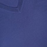 Close-up of the V-Neck Wool Cashmere Sweater in blue, showcasing its fine knit texture and classic V-neck design. The label in the top left corner displays the BRUNELLO CUCINELLI brand name, highlighting the luxurious quality of this wool cashmere piece.