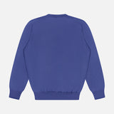 The BRUNELLO CUCINELLI V-Neck Wool Cashmere Sweater is displayed from the back against a white background. Inspired by a classic men's v-neck style, this blue sweater features ribbed cuffs and waistband for a comfortable fit.