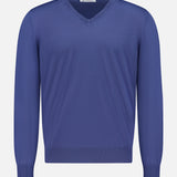 The BRUNELLO CUCINELLI V-Neck Wool Cashmere Sweater for men, featuring long sleeves in a blue hue, is displayed against a white background.