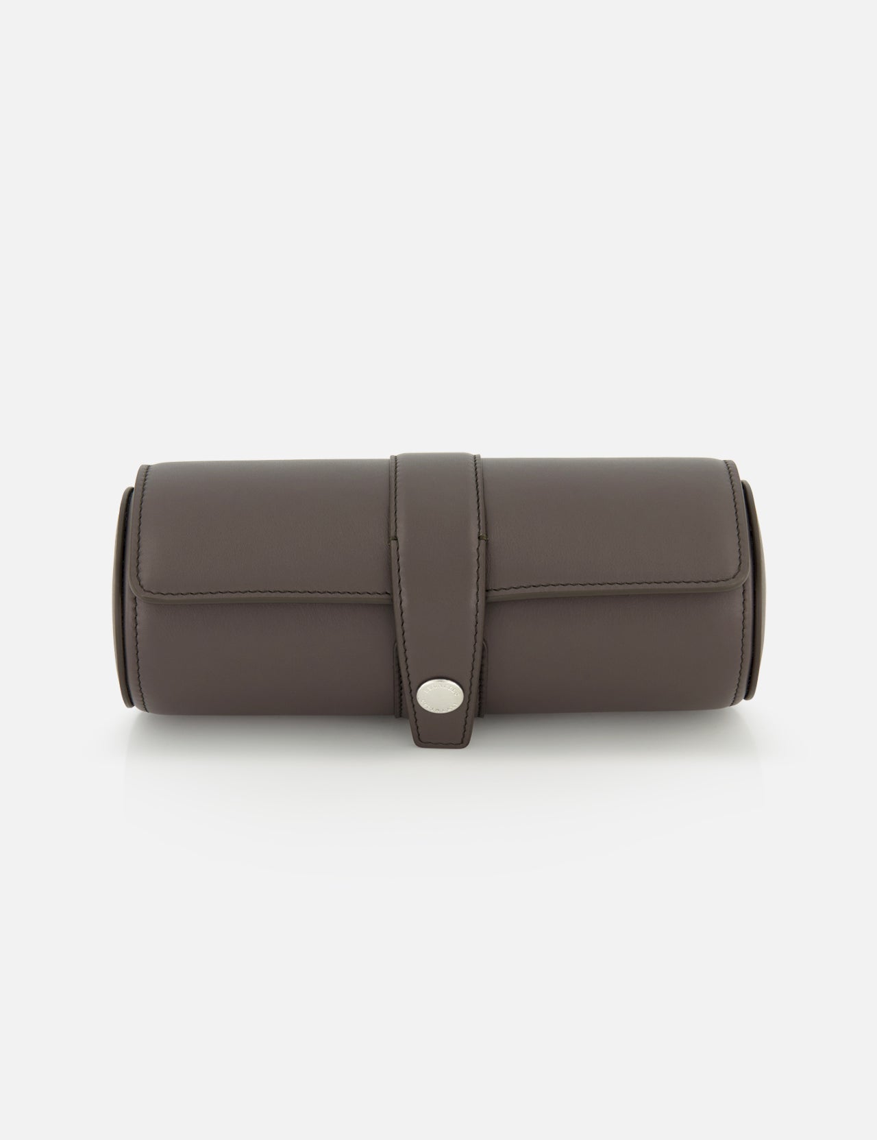 The BRUNELLO CUCINELLI Leather Watch Case is a cylindrical dark brown leather holder featuring a flap closure with a silver button, making it an elegant addition to your travel accessories. Shown against a white background.