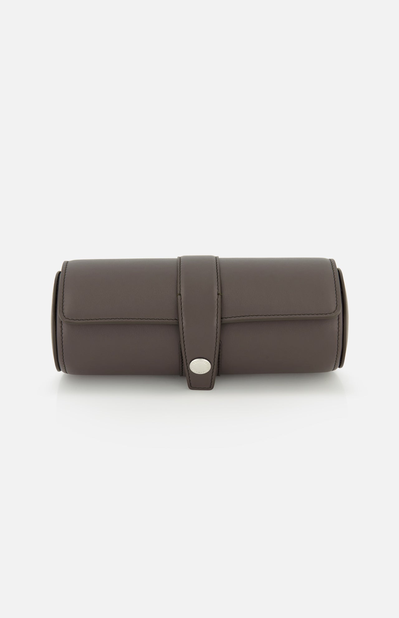The BRUNELLO CUCINELLI Leather Watch Case is a cylindrical dark brown leather holder featuring a flap closure with a silver button, making it an elegant addition to your travel accessories. Shown against a white background.