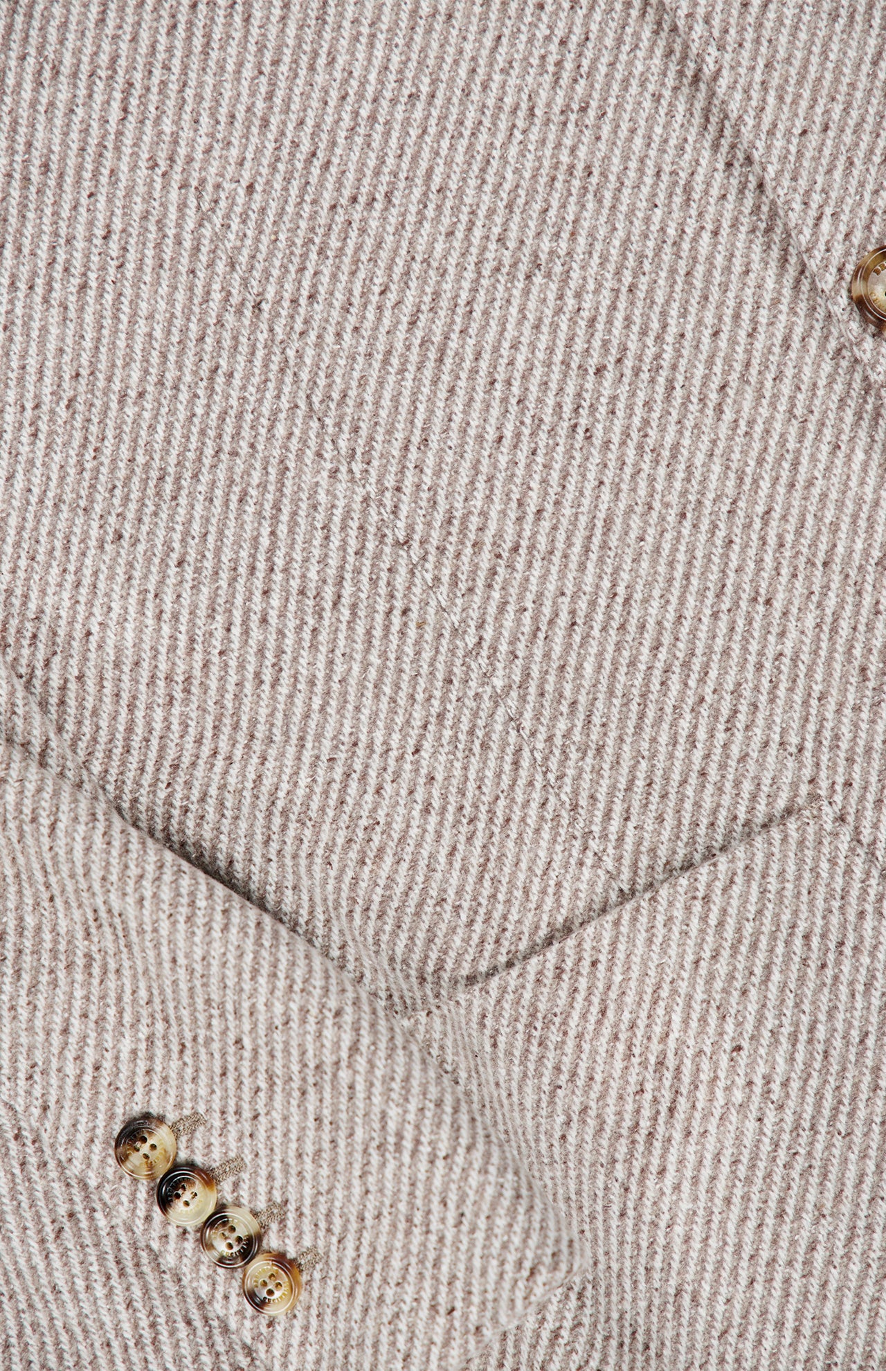Close-up of the Water Resistant Cashmere Sport Jacket by BRUNELLO CUCINELLI, featuring a beige and white pinstripe pattern. This Italian-made blazer showcases a front pocket and four brown buttons on the sleeve, with visible fabric texture and stitching that emphasize the refined craftsmanship characteristic of BRUNELLO CUCINELLI’s cashmere sport jackets.