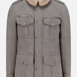 The BRUNELLO CUCINELLI Water Resistant Safari Jacket features a gray design with four front flap pockets, gold buttons, a zippered left chest pocket, shoulder epaulets, and a detachable beige shearling collar. The jacket is shown against a white background.