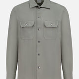 BRUNELLO CUCINELLI Western Cotton Long Sleeve Shirt in light gray, featuring soft garment-dyed gabardine, two front chest pockets, and metal snap buttons, displayed on a plain white background.