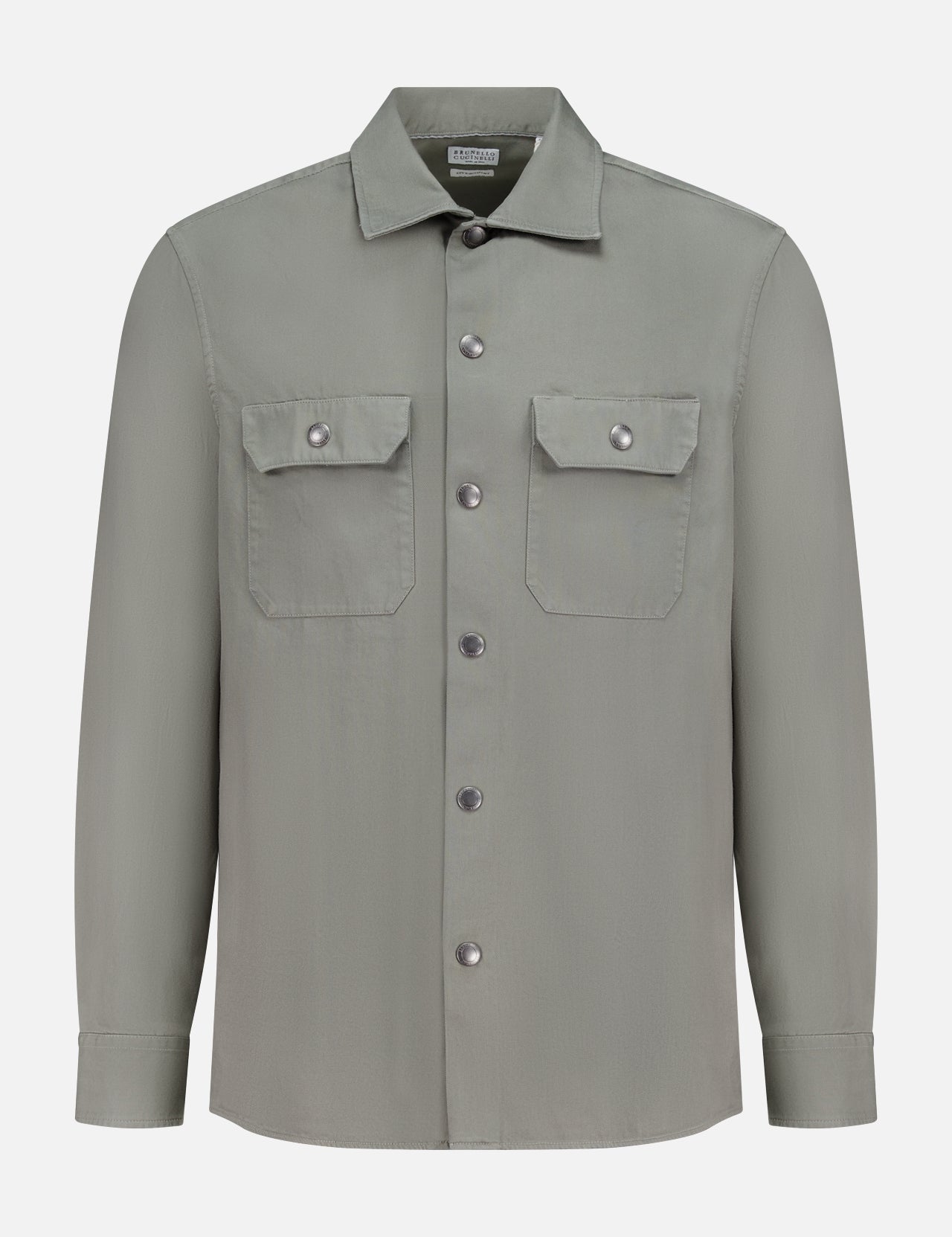 BRUNELLO CUCINELLI Western Cotton Long Sleeve Shirt in light gray, featuring soft garment-dyed gabardine, two front chest pockets, and metal snap buttons, displayed on a plain white background.
