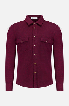 A maroon Snap-front Western Overshirt by BRUNELLO CUCINELLI, featuring long sleeves, a classic collar, and brown snap buttons down the front. The luxury Italian design includes two chest pockets, each secured with a snap button. Photographed against a plain white background.