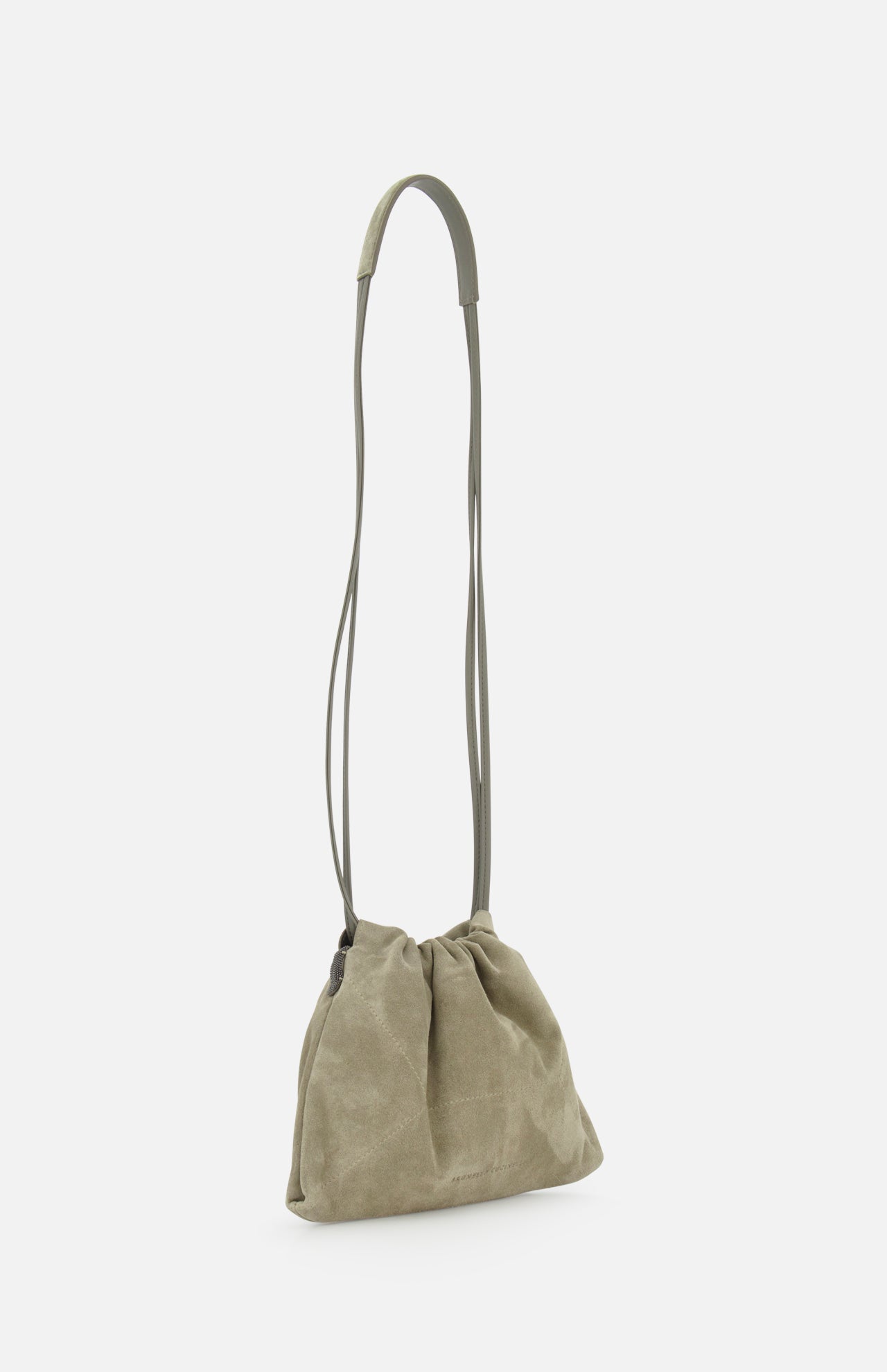 The BRUNELLO CUCINELLI Soft Suede Mini Pouchette Bag features light olive-green suede and leather, a long thin strap, and a gathered slouchy design, shown on a plain white background.