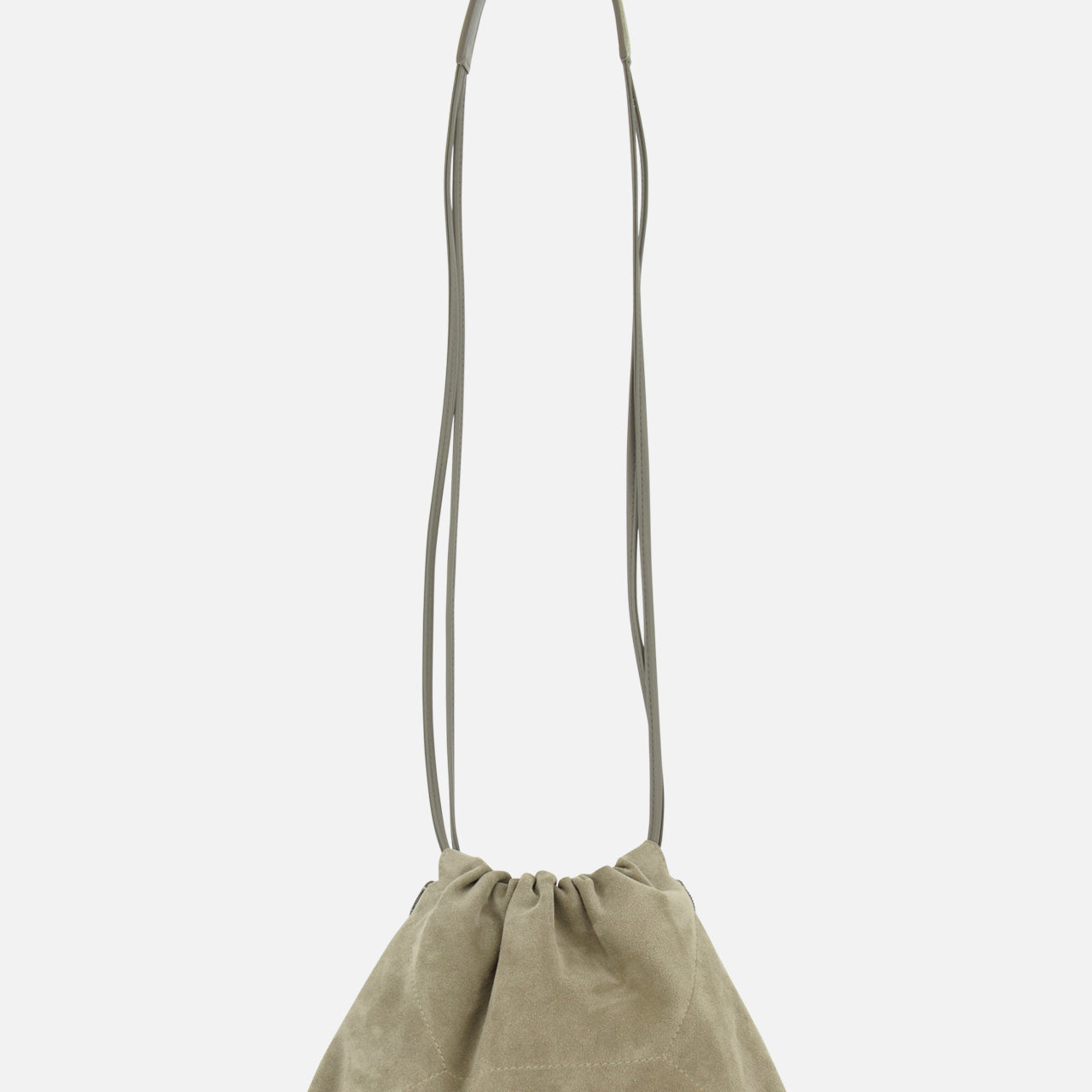 The Soft Suede Mini Pouchette Bag by BRUNELLO CUCINELLI features light olive green suede and leather, a long thin strap, and a soft, slouchy silhouette with minimalist design. Shown against a plain white background.