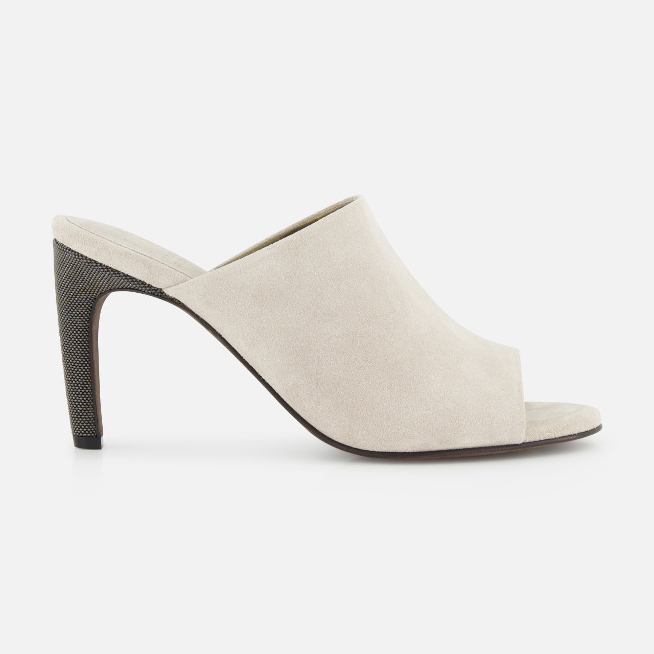 The BRUNELLO CUCINELLI Suede Curved Monili 80MM Mule Heel, in beige suede with a high tapered heel and minimalist slip-on design, is displayed in side view against a white background.