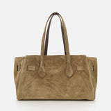 The Explorer Suede Medium Shopper Bag by BRUNELLO CUCINELLI is a spacious taupe suede shoulder bag featuring two elongated handles, a rectangular silhouette, and refined stitching accents—crafted in Italy with travel-inspired design, shown against a plain white background.