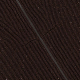 Close-up of dark brown cashmere fabric with a subtle diagonal seam, textured with fine, wavy lines and small, scattered shiny specks throughout the surface—characteristic of the BRUNELLO CUCINELLI Cashmere Double Shiny Rub Zip Cardigan Sweater.