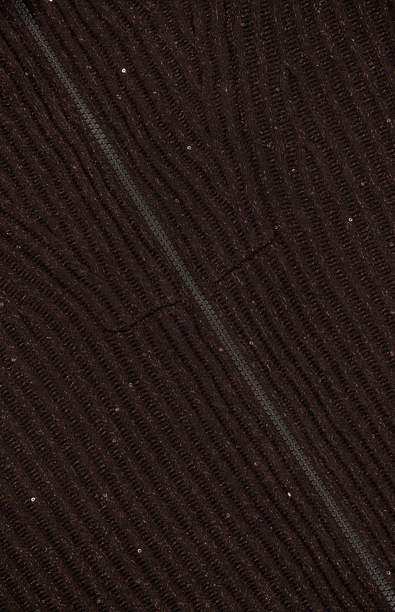 Close-up of dark brown cashmere fabric with a subtle diagonal seam, textured with fine, wavy lines and small, scattered shiny specks throughout the surface—characteristic of the BRUNELLO CUCINELLI Cashmere Double Shiny Rub Zip Cardigan Sweater.