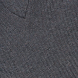 Close-up of the textured vertical ribbing on a dark gray Cashmere Stretch Lurex Rib Knit Dress by BRUNELLO CUCINELLI, highlighting the fabric’s knit structure and luxurious material.