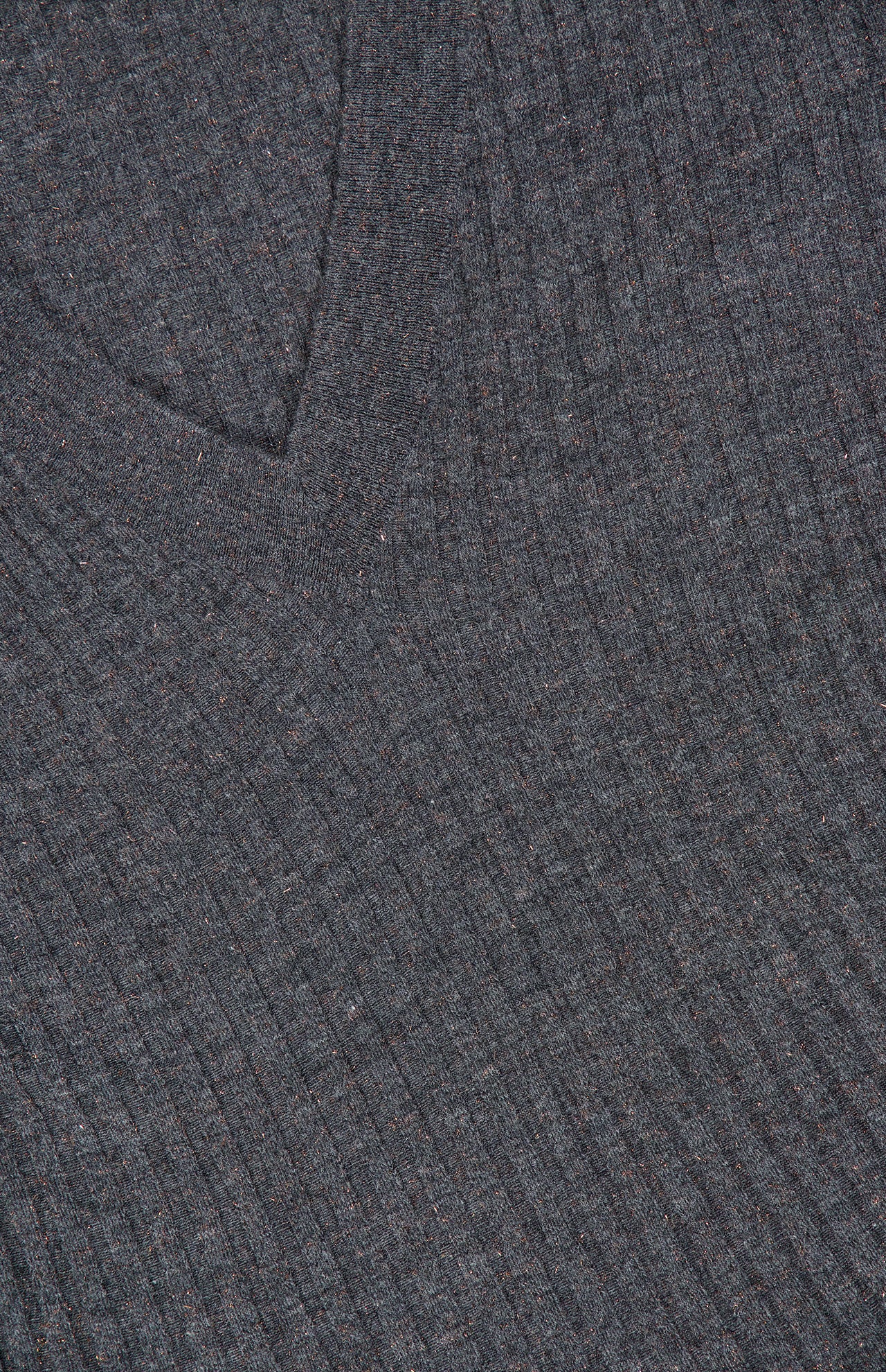 Close-up of the textured vertical ribbing on a dark gray Cashmere Stretch Lurex Rib Knit Dress by BRUNELLO CUCINELLI, highlighting the fabric’s knit structure and luxurious material.