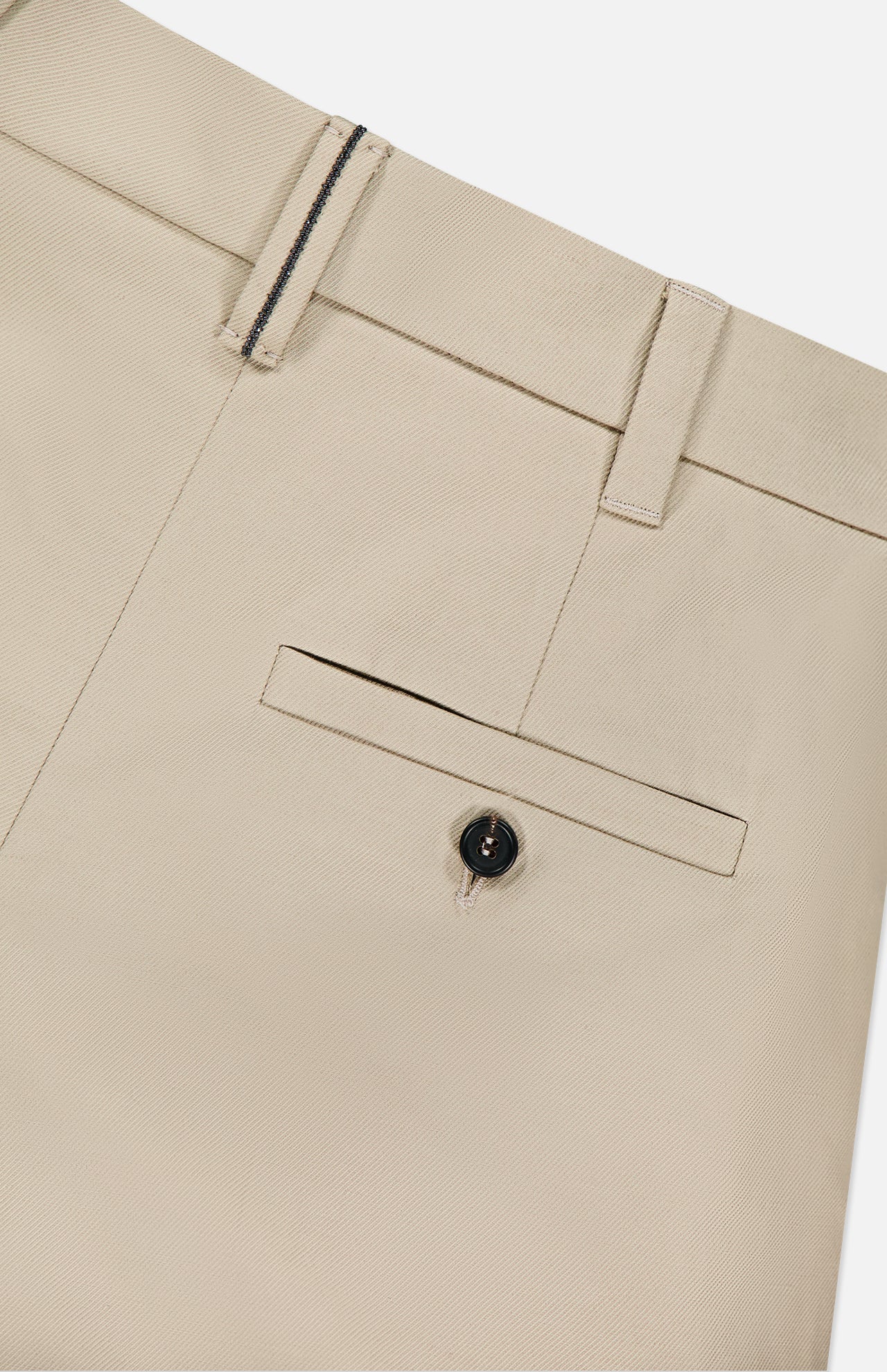 Close-up of BRUNELLO CUCINELLI Cotton Linen Bull Bermuda Pleated Short in beige; features a cotton-linen blend, waistband with belt loops, back pocket with button closure, and detailed stitching.