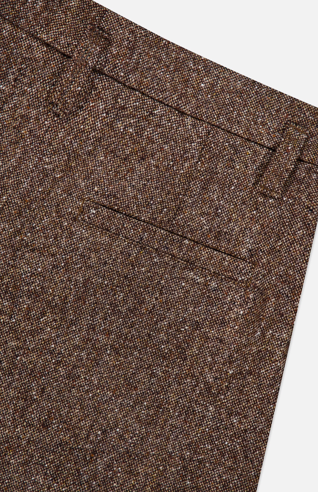 Close-up of the BRUNELLO CUCINELLI Donegal Wool Barrel Pleated Pant, featuring a classic barrel fit in brown tweed wool with a waistband adorned with belt loops and a small front pocket, displayed against a white background.