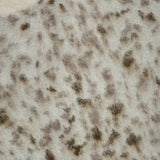 Close-up of a Brunello Cucinelli Jacquard Mohair Knitted Long Sleeve Sweater in fuzzy cream mohair wool with an abstract brown lynx jacquard pattern and a ribbed neckline.