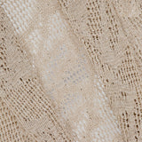 Close-up of the Linen Cotton Shawl Collar Cardigan by BRUNELLO CUCINELLI, showcasing light beige knit, intricate texture, and delicate lace effect. The brand’s white label appears in the upper left corner.