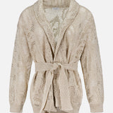 The BRUNELLO CUCINELLI Linen Cotton Shawl Collar Cardigan features a beige hue, long sleeves, a matching waist belt, a semi-sheer texture, and a subtle floral lace-effect design. Shown on a white background.