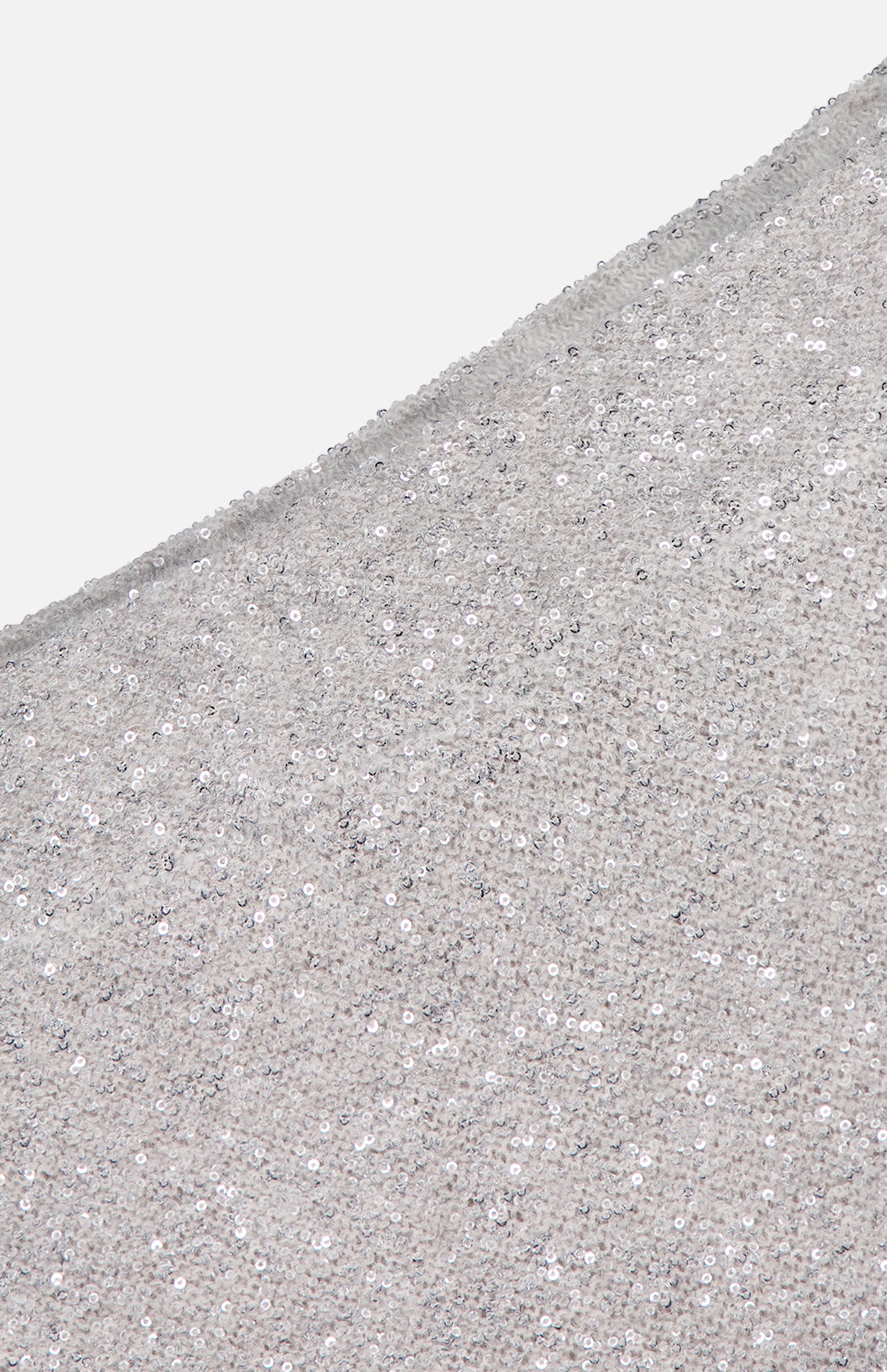 Close-up of a light silver Linen Mohair Diamante Knit Pencil Skirt from BRUNELLO CUCINELLI, densely adorned with shiny sequins for a sparkling, textured effect—an elegant choice for your next cocktail party. The fabric curves gently at the top left.