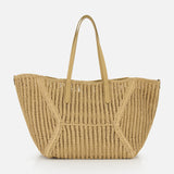 The Medium Duo Raffia Tote Bag by BRUNELLO CUCINELLI features two tan leather handles and a woven raffia design, shown against a white background—an ideal companion for sunny days at the beach.