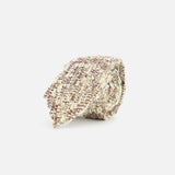 The BRUNELLO CUCINELLI Mohair Sparkling Diamante Tie, featuring luxurious mohair in beige and brown tones with textured detailing, adds an elevated touch to any menswear ensemble—and is displayed against a clean white background.