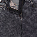 A pair of BRUNELLO CUCINELLI Prince Of Whales Embossed Wide Barrel Jeans with the fly slightly open, showcasing the striped inner pocket lining and zipper—designed with a refined wide barrel fit for a relaxed yet modern silhouette.