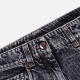 Close-up of the waist area of BRUNELLO CUCINELLI’s Prince Of Whales Embossed Wide Barrel Jean in grey, showcasing a copper button, visible front pocket, belt loops, and orange stitching against a white background.