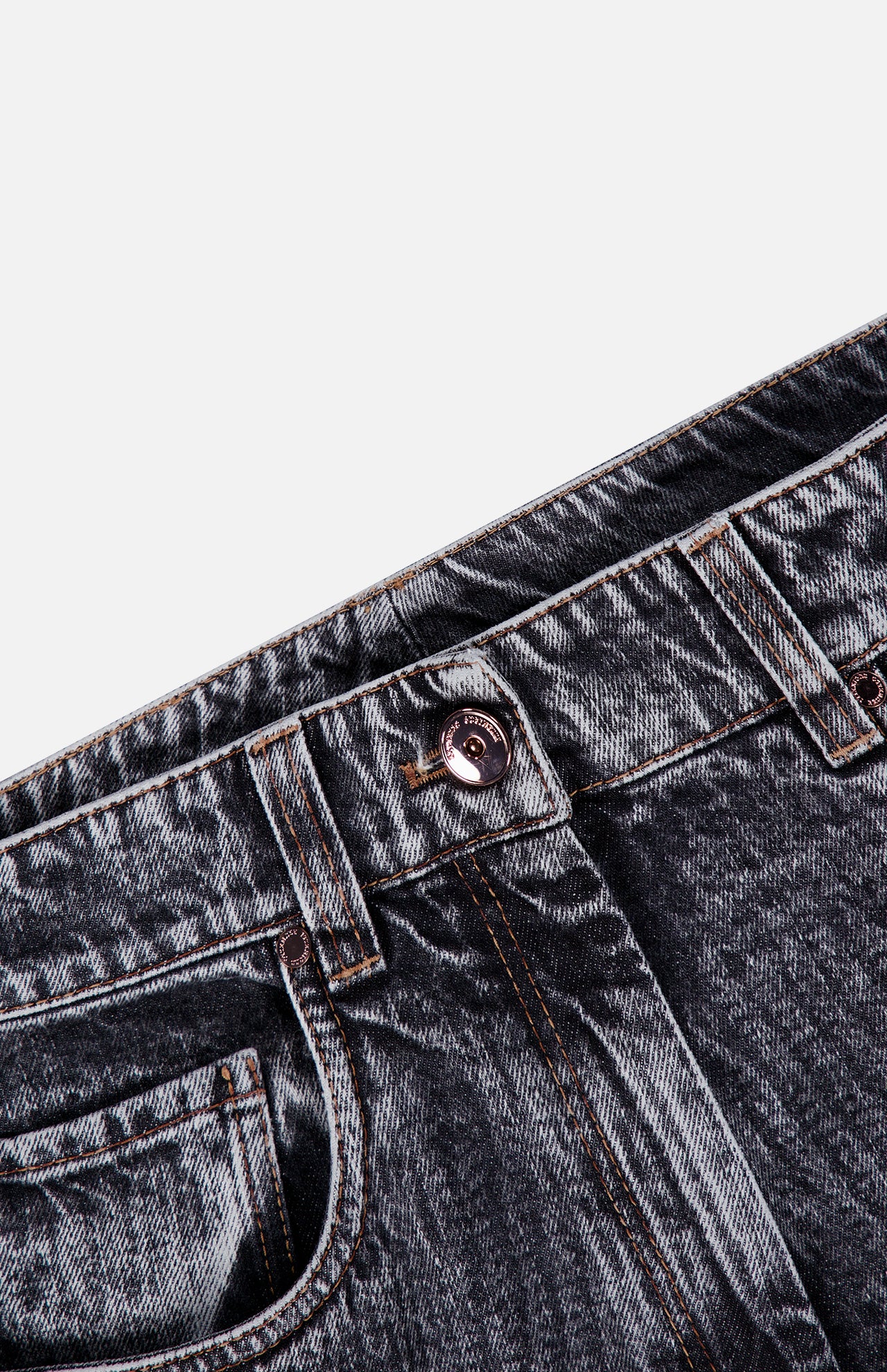 Close-up of the waist area of BRUNELLO CUCINELLI’s Prince Of Whales Embossed Wide Barrel Jean in grey, showcasing a copper button, visible front pocket, belt loops, and orange stitching against a white background.