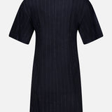 Back view of the BRUNELLO CUCINELLI Sequin Pinstripe Wool Dress with Monili Collar, a short-sleeved, knee-length black dress featuring subtle thin vertical pinstripes and a simple, straight silhouette inspired by tailored womenswear.