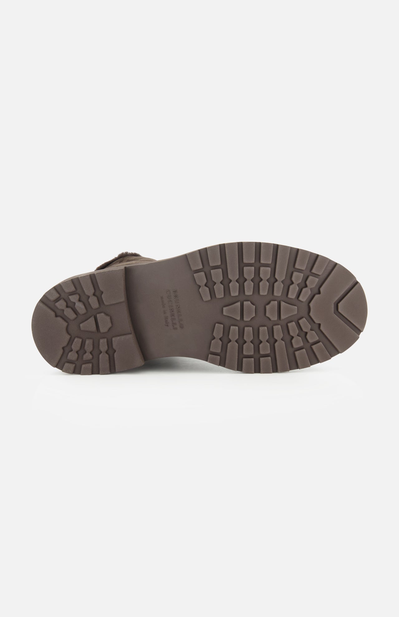 Brown rubber sole with a deep, rugged tread pattern, shown from the bottom against a plain white background—perfect for the BRUNELLO CUCINELLI Shearling Lined Lace Boot with Monili Tabs.