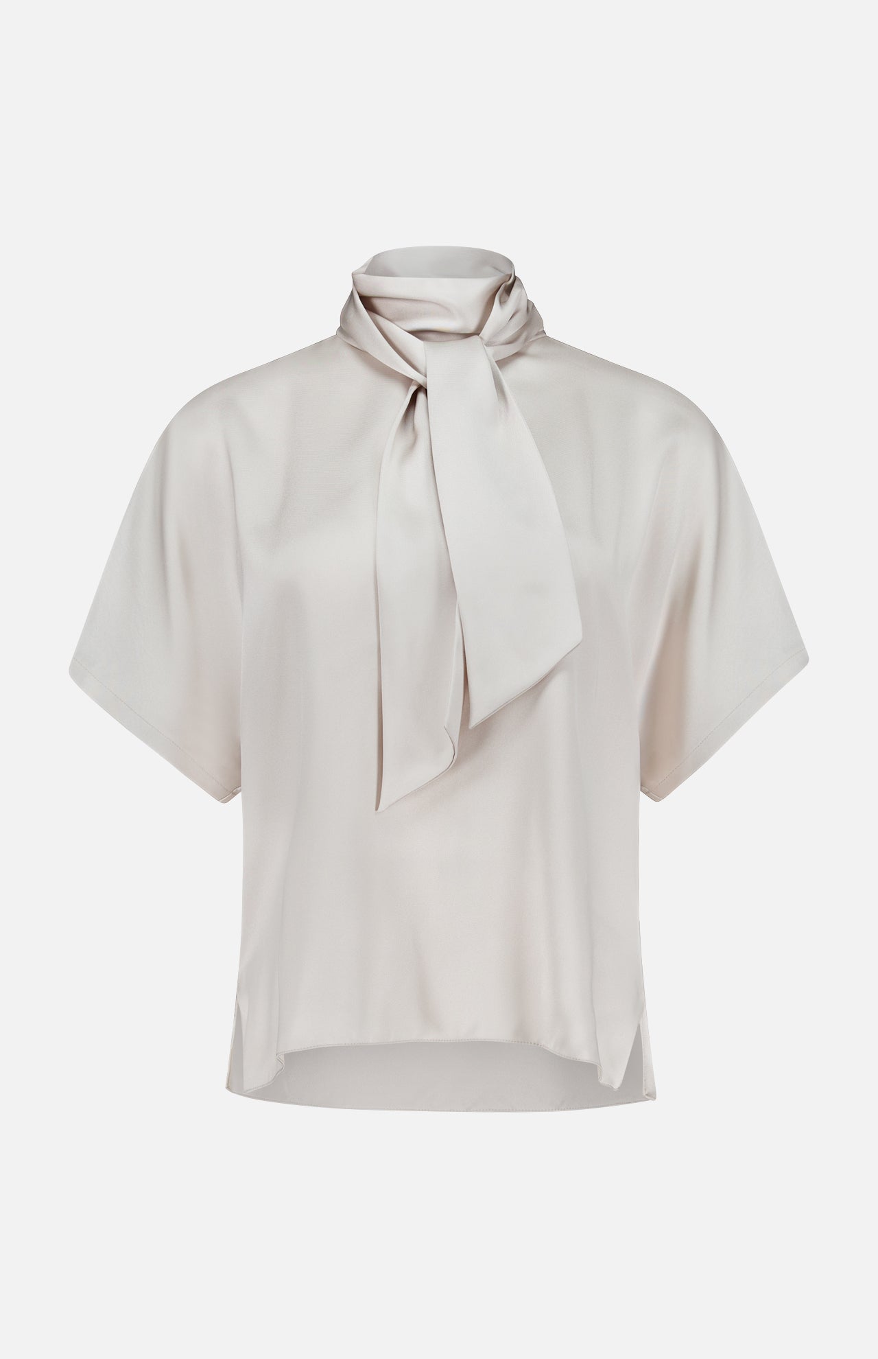 The BRUNELLO CUCINELLI Silk Satin Short Sleeve Blouse in light beige features a loose fit, short sleeves, and a high neck tie detail, shown against a plain white background.