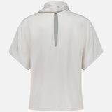 Back view of the BRUNELLO CUCINELLI Silk Satin Short Sleeve Blouse in light beige, featuring a high collar and keyhole opening at the upper back. The smooth silk satin fabric has a subtle sheen.