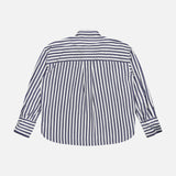 Back view of a Brunello Cucinelli Silk Striped Refined Western Blouse featuring navy and white vertical stripes and Mother of Pearl buttons.