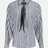 Brunello Cucinelli Silk Striped Refined Western Blouse: long-sleeved silk blouse with vertical blue and white stripes, featuring a pointed, removable collar, Mother of Pearl buttons, and a dark neck tie detail.