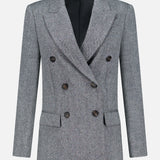 The Sparkling Wool Herringbone Blazer by BRUNELLO CUCINELLI features a double-breasted design in gray wool with a classic herringbone pattern, black buttons, notched lapels, flap pockets, and long sleeves, displayed against a plain white background.