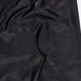 Close-up of the back of the BRUNELLO CUCINELLI Stretch Leather Legging in black, highlighting the waistband and seam details—a modern womenswear essential crafted from supple stretch leather for exceptional style and comfort.