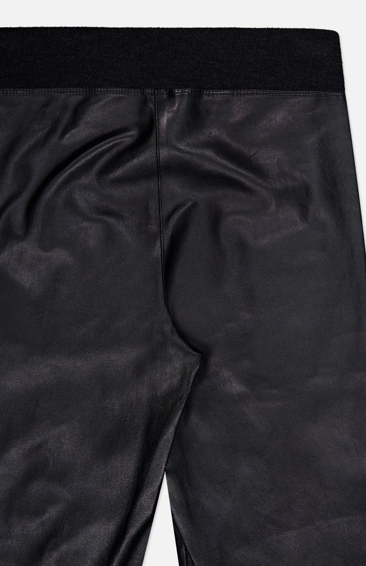 Close-up of the back of the BRUNELLO CUCINELLI Stretch Leather Legging in black, highlighting the waistband and seam details—a modern womenswear essential crafted from supple stretch leather for exceptional style and comfort.