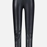 The BRUNELLO CUCINELLI Stretch Leather Legging features a high waist and seam detailing down the front and across the knees, crafted in classic black faux leather. Displayed against a plain light gray background, these leggings effortlessly elevate your womenswear wardrobe with their perfect blend of comfort and style.