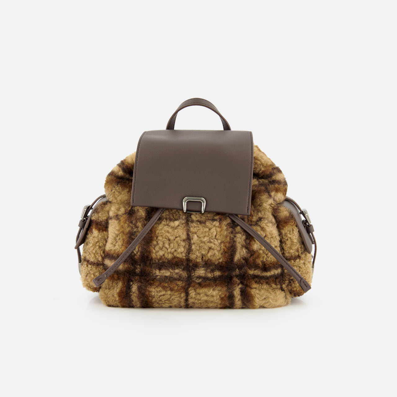 The BRUNELLO CUCINELLI Tartan Curly Shearling Backpack showcases a stylish design with a brown leather flap and handle, complemented by soft, curly yellow and brown plaid shearling in a classic tartan pattern on the main body and sides, all presented against a plain white background.
