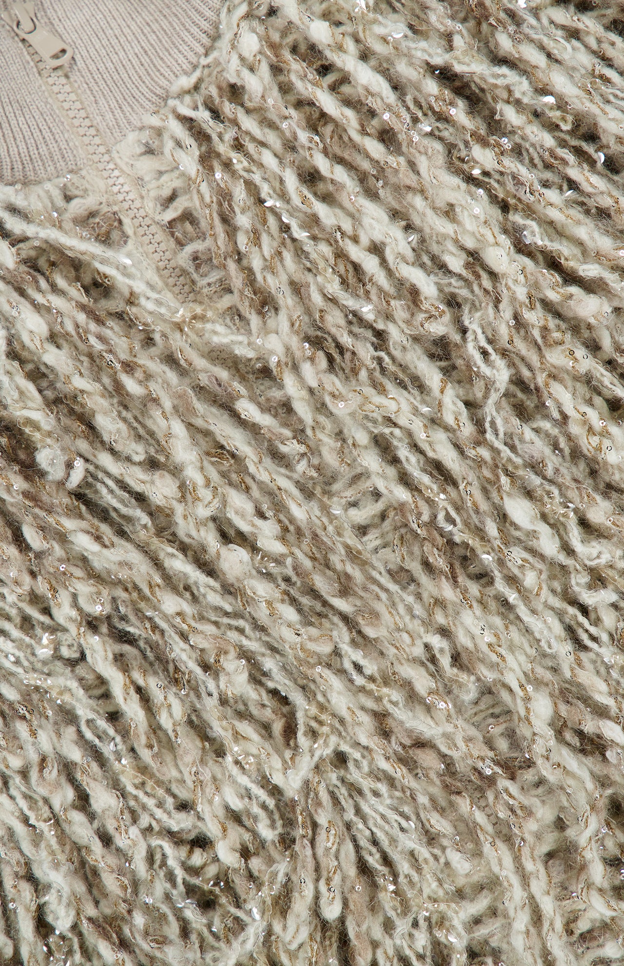 Close-up of a neutral Brunello Cucinelli Twisted Fringed Wool Mohair Zip Vest made from textured, multi-tonal twisted fringe yarn embellished with small, shimmering sequins.