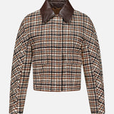 The BRUNELLO CUCINELLI Vintage Wool Check Print Bomber Jacket features a cropped silhouette with long sleeves, a front closure, and a wide dark brown leather collar. Showcasing a classic brown, black, and white check pattern reminiscent of vintage wool designs, this sophisticated piece draws inspiration from iconic Brunello Cucinelli styling. Displayed against a plain white background, it’s an effortlessly chic addition to any bomber jacket collection.
